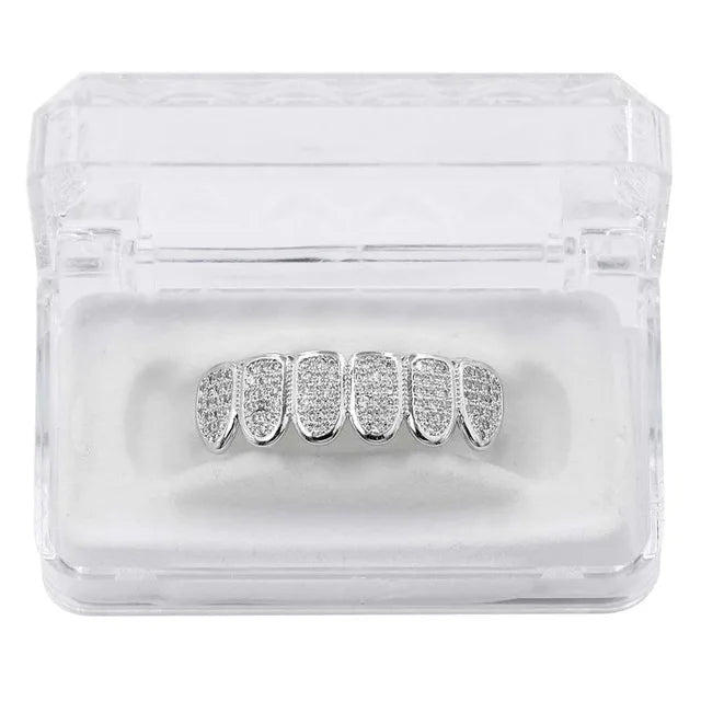 Silver grillz in a clear box 